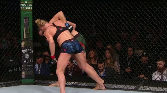 Holm dominates clinch in rematch with Pennington