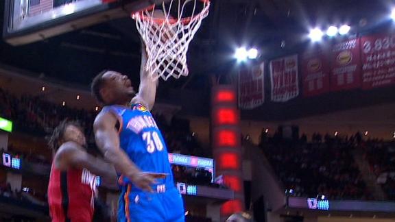 Burton rocks the rim with a vicious slam