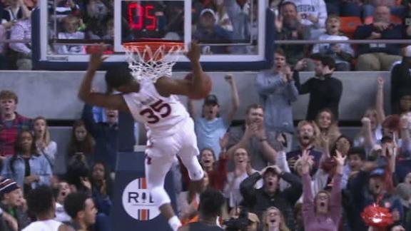 Cambridge slams home a miss off the backboard