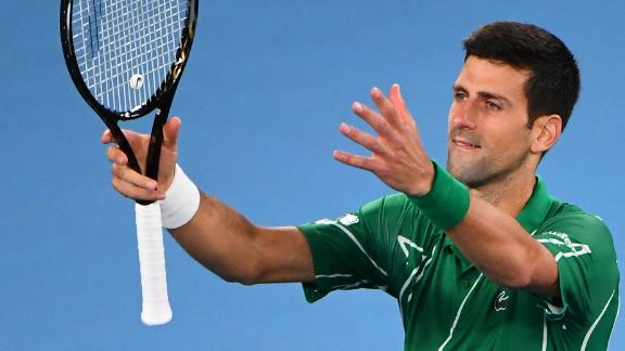 Djokovic eases past Raonic to set up Federer semifinal