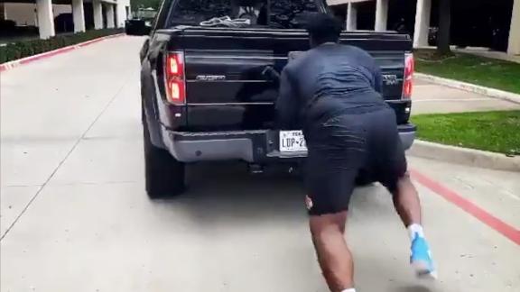 First-round OL prospect displays his strength by pushing a truck