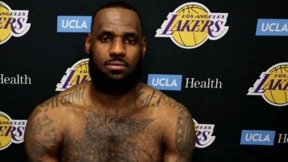 Los Angeles Lakers forward LeBron James (23) points at a team mate during  the second half of an NBA basketball game against the Portland Trail  Blazers Friday, Feb. 26, 2021, in Los