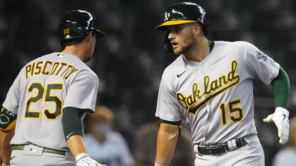 Oakland Athletics' Mark Canha stands in the on deck circle in