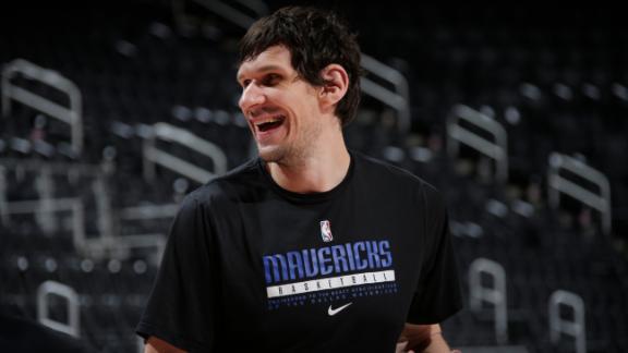 Dallas Mavericks' Boban Marjanovic shakes hands with a fan prior