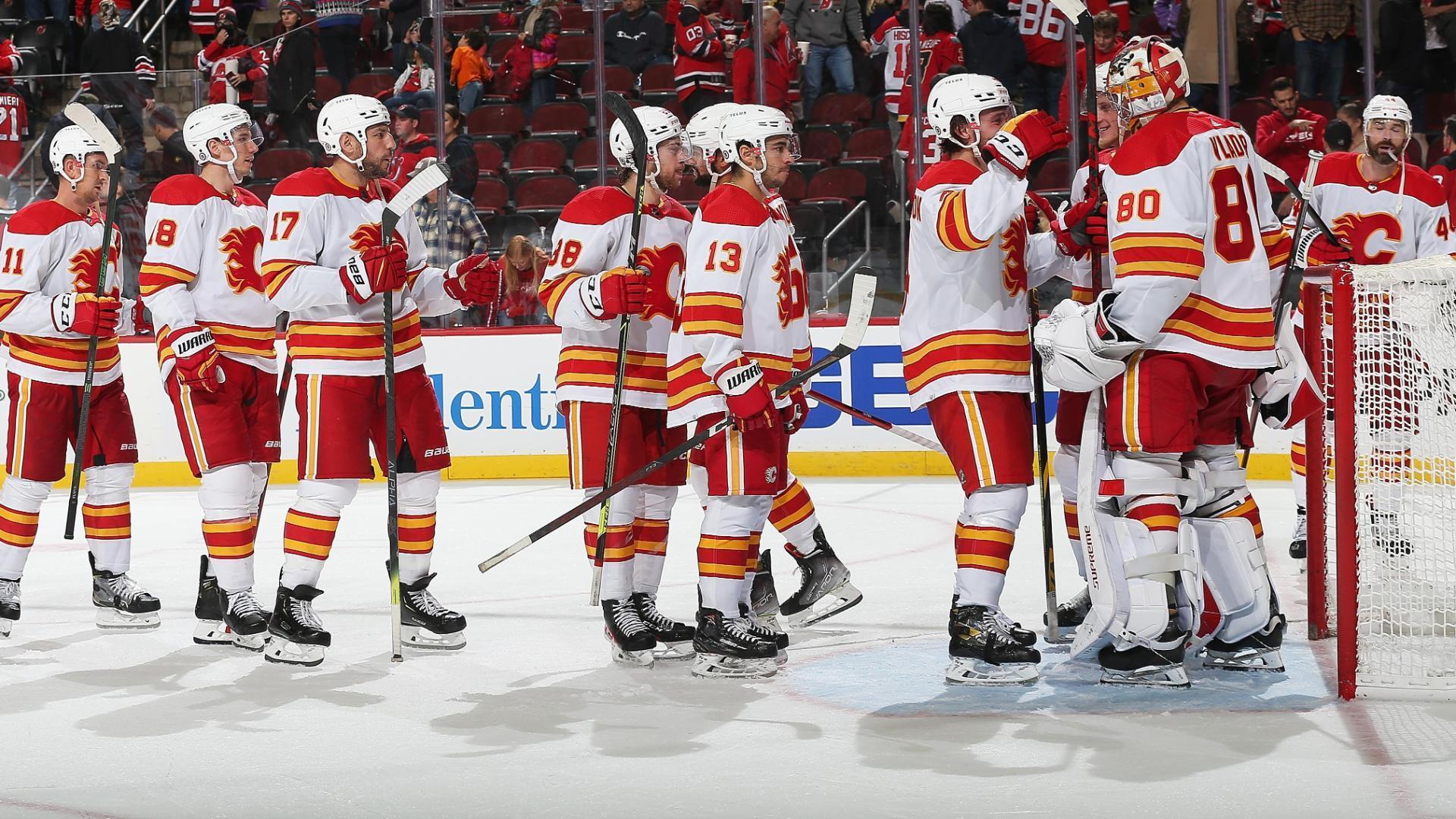 Flames use 4-goal outburst in 1st period to beat Devils 5-3