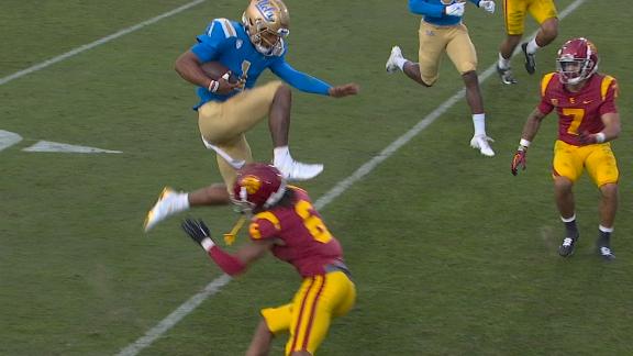UCLA QB clears a defender en route to a TD