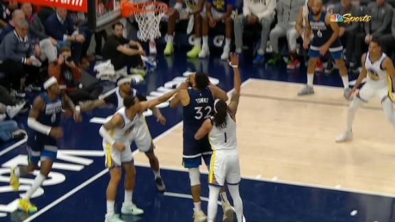 KAT fights off defenders under the basket to toss in the and-1 bucket