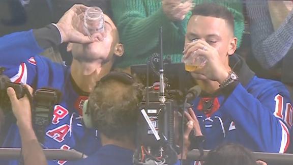 Rizzo, Judge and LeMahieu down beers at Rangers game