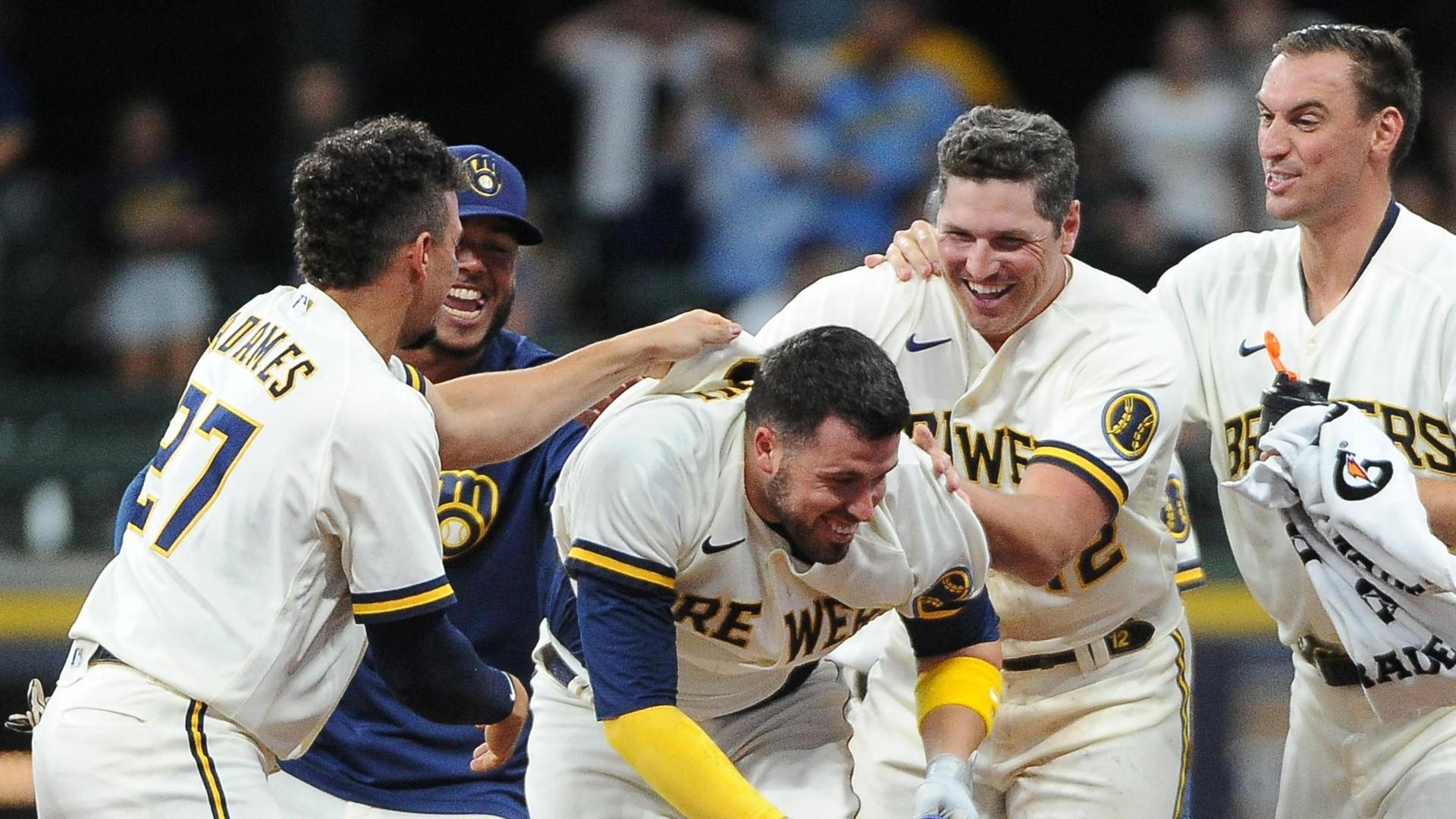 Milwaukee Brewers left fielder Andrew McCutchen catches for an out