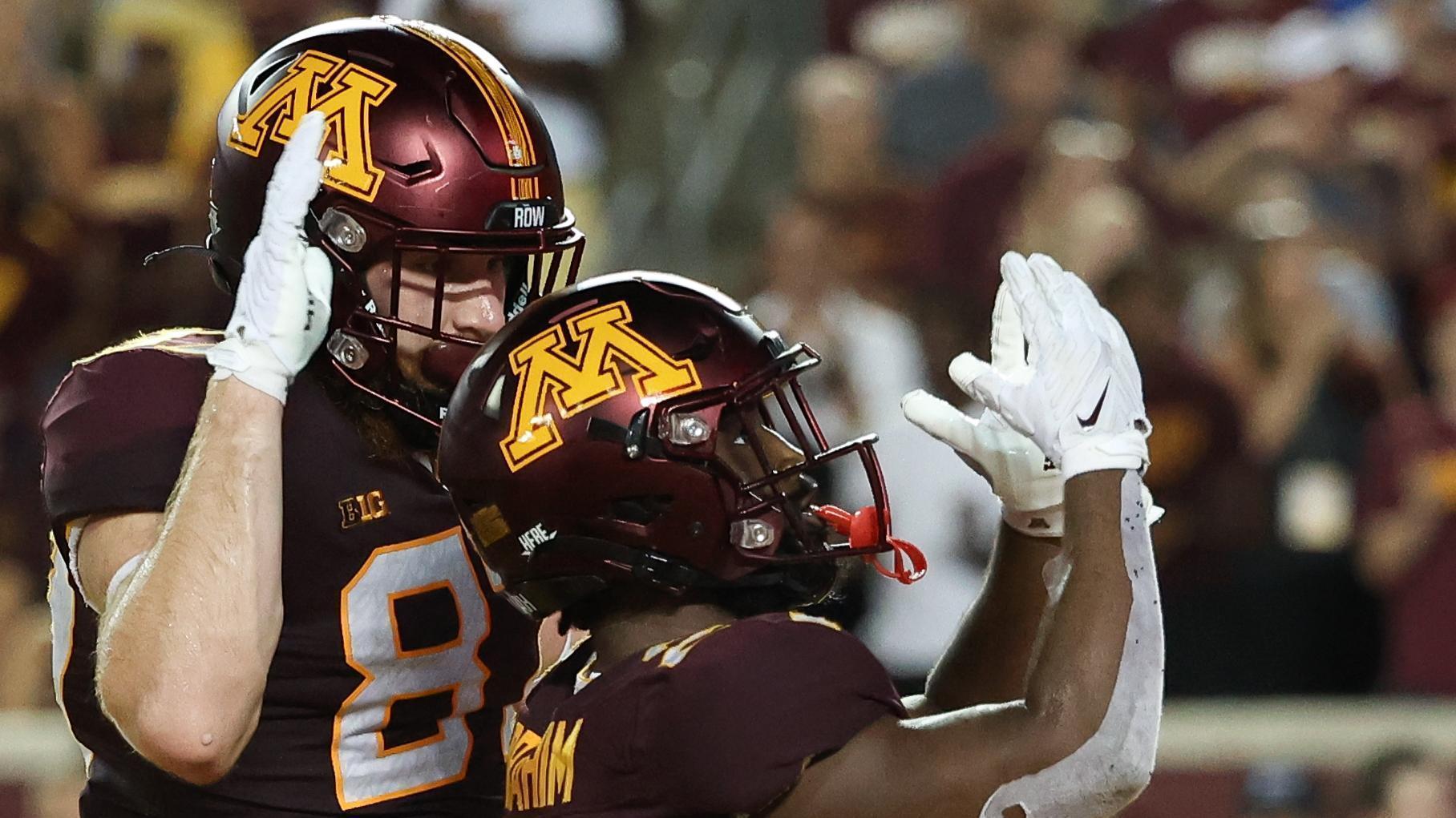 Trey Potts of the Minnesota Golden Gophers runs up the field in the
