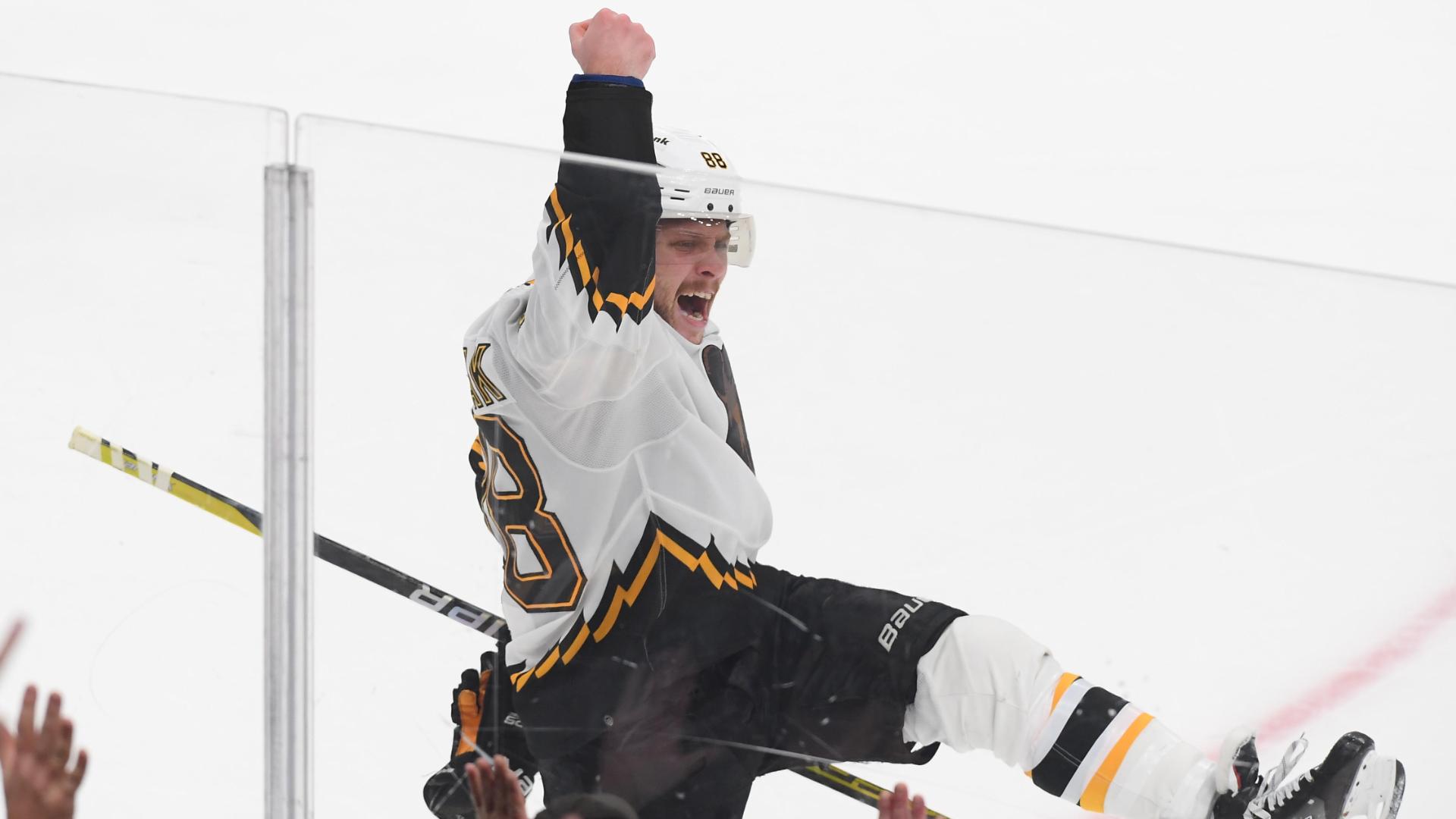 Boston Bruins set NHL record with 12th straight home win to open