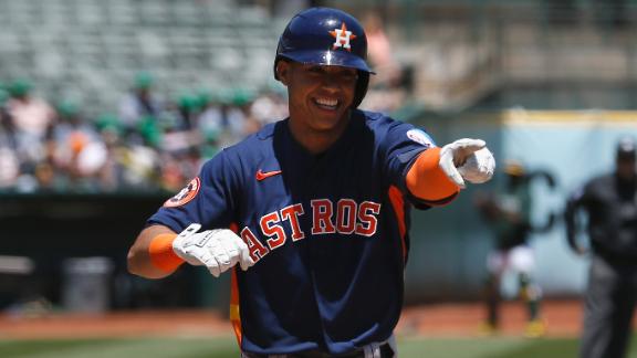 Houston Astros' Jeremy Pena walks off the field after popping out