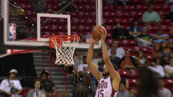 Houston Rockets' Nate Hinton shoots overCleveland Cavaliers' Pete