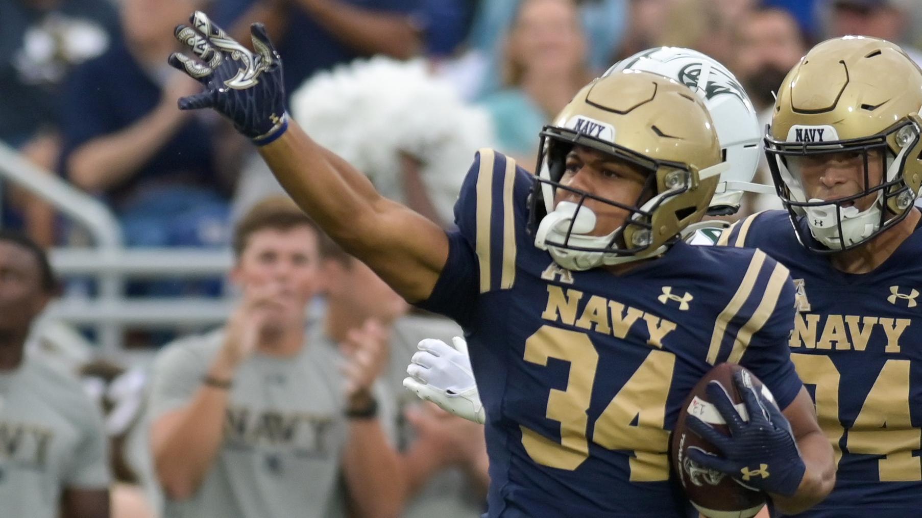 ANNAPOLIS, MD - SEPTEMBER 09: Wagner Seahawks quarterback Steven Krajewski  (8) is pressured by safety Rayuan Lane III (18) during the Wagner Seahawks  game versus the Naval Academy Midshipmen on September 9