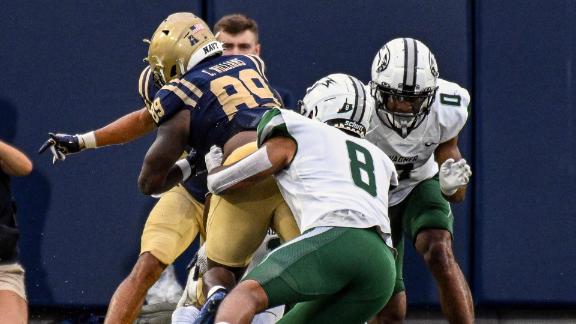 ANNAPOLIS, MD - SEPTEMBER 09: Wagner Seahawks quarterback Steven Krajewski  (8) is pressured by safety Rayuan Lane III (18) during the Wagner Seahawks  game versus the Naval Academy Midshipmen on September 9