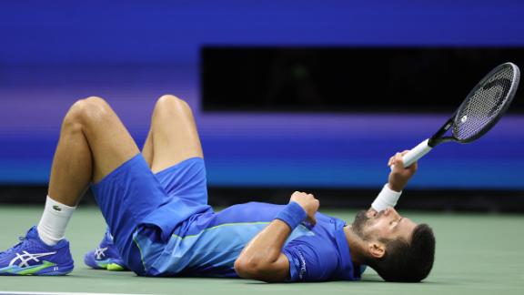 Djokovic falls to the court after losing tough rally to Medvedev