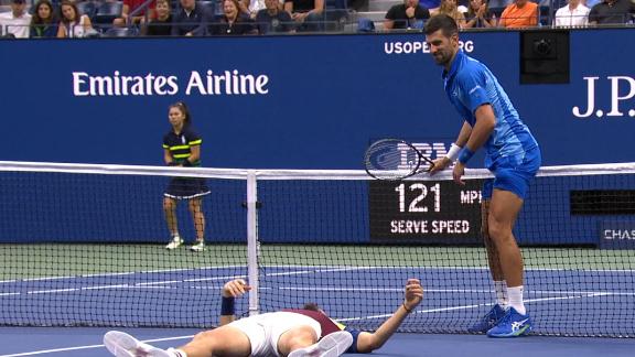 Djokovic climbs over net to check on shaken-up Medvedev