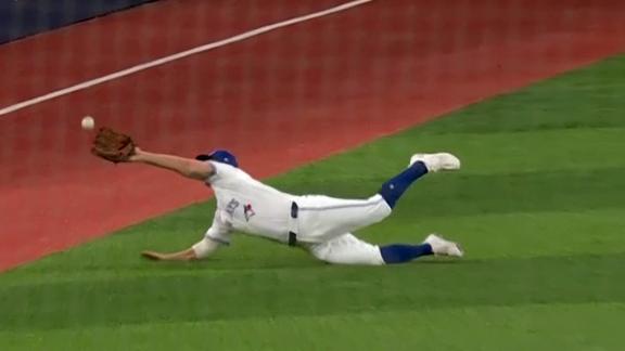 Davis Schneider lays out for a spectacular diving catch