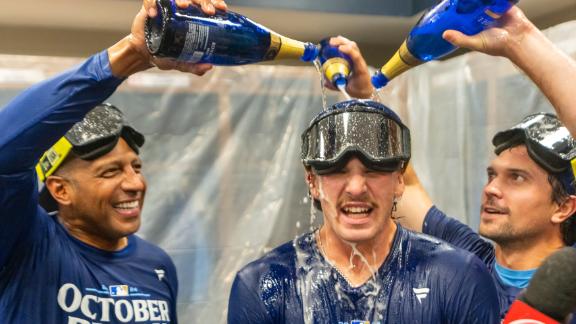 Royals celebrate with champagne after clinching playoff berth