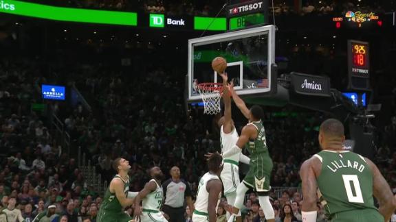 Giannis Antetokounmpo drives to the rack looking for a layup, but Al Horford swats his attempt away.