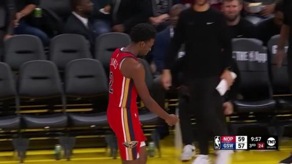 Herb Jones attempts to dive for a loose ball, but gets injured when Brandin Podziemski lands on him.