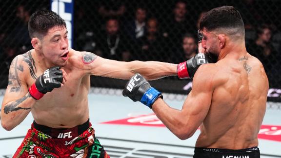 Brandon Moreno landing a punch in the Octagon