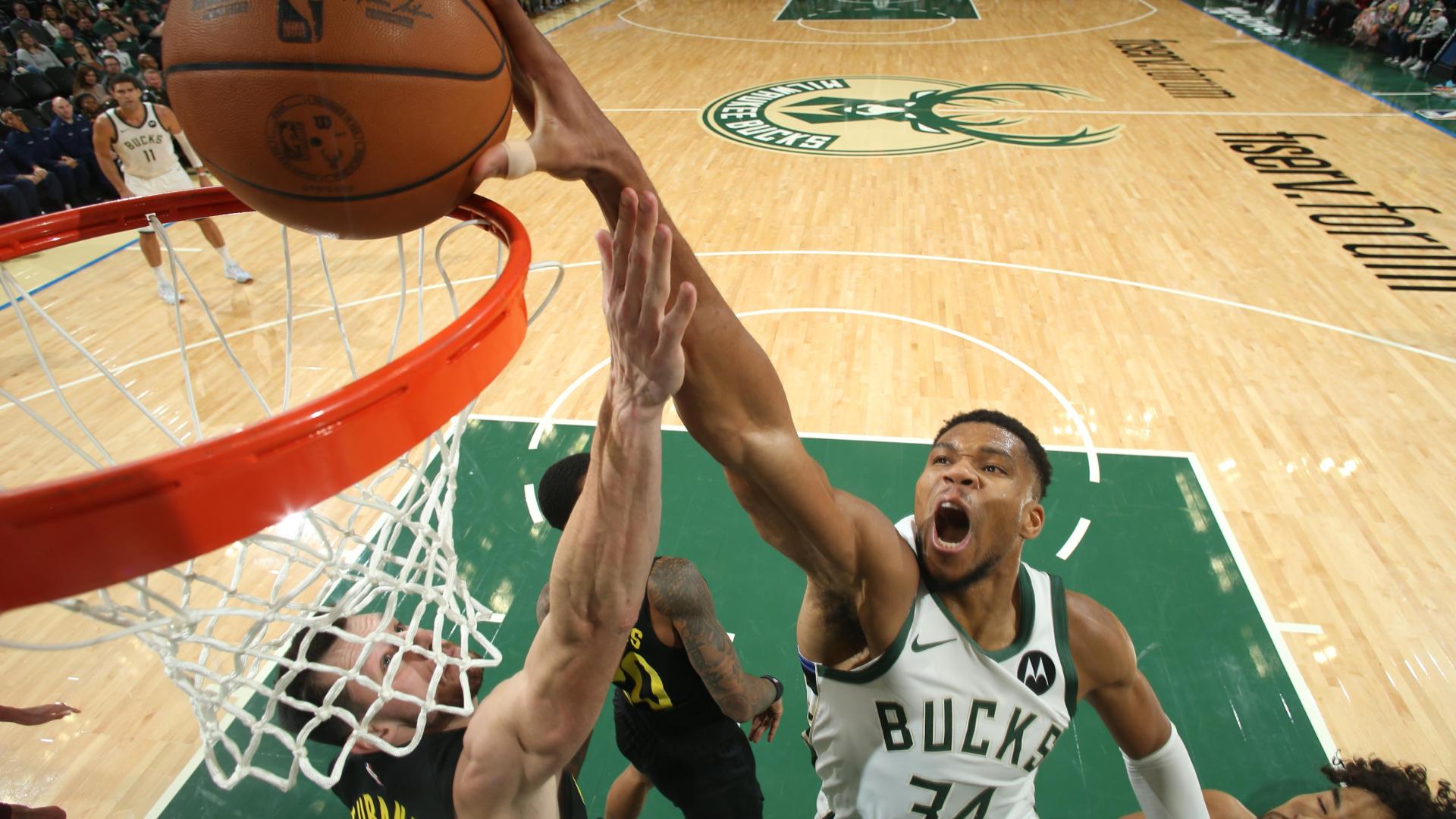 Giannis Antetokounmpo gets a pickpocket steal on John Collins and takes it all the way for an emphatic one-handed jam.