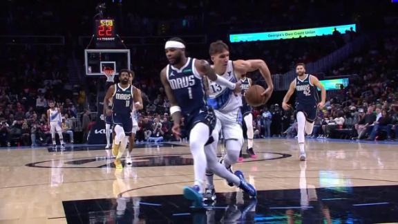 Bogdan Bogdanovic goes behind his back en route to a transition layup for the Hawks.