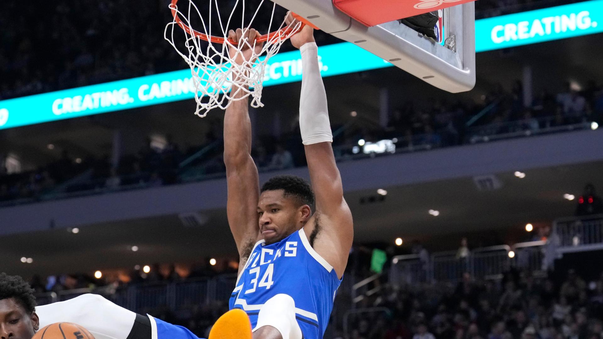 Giannis Antetokounmpo slams it home with authority for the Bucks.