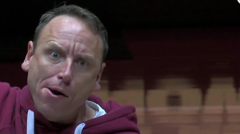 Competitive eater Joey Chestnut gobbles down an impressive 47 pierogies during a halftime eating contest at the Hawks-Cavaliers game.