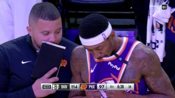 Bradley Beal limps off the court late in the fourth quarter of the Suns' loss to the Nets.