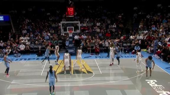 Jaylen Wells sinks an impressive 3-pointer while drawing a foul.