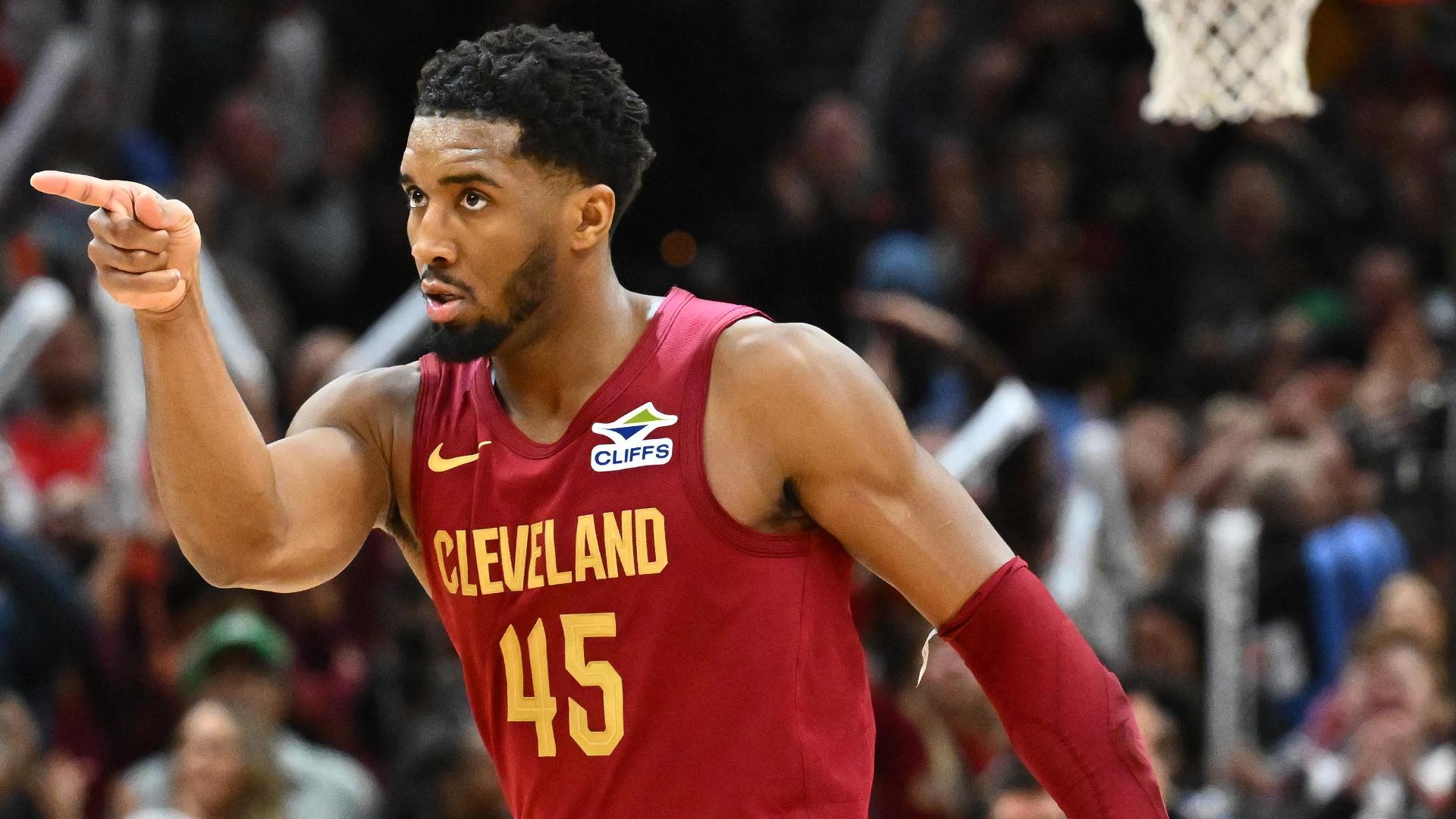 Donovan Mitchell evades his defender with a slick spin move and finishes at the basket with a tough jumper.