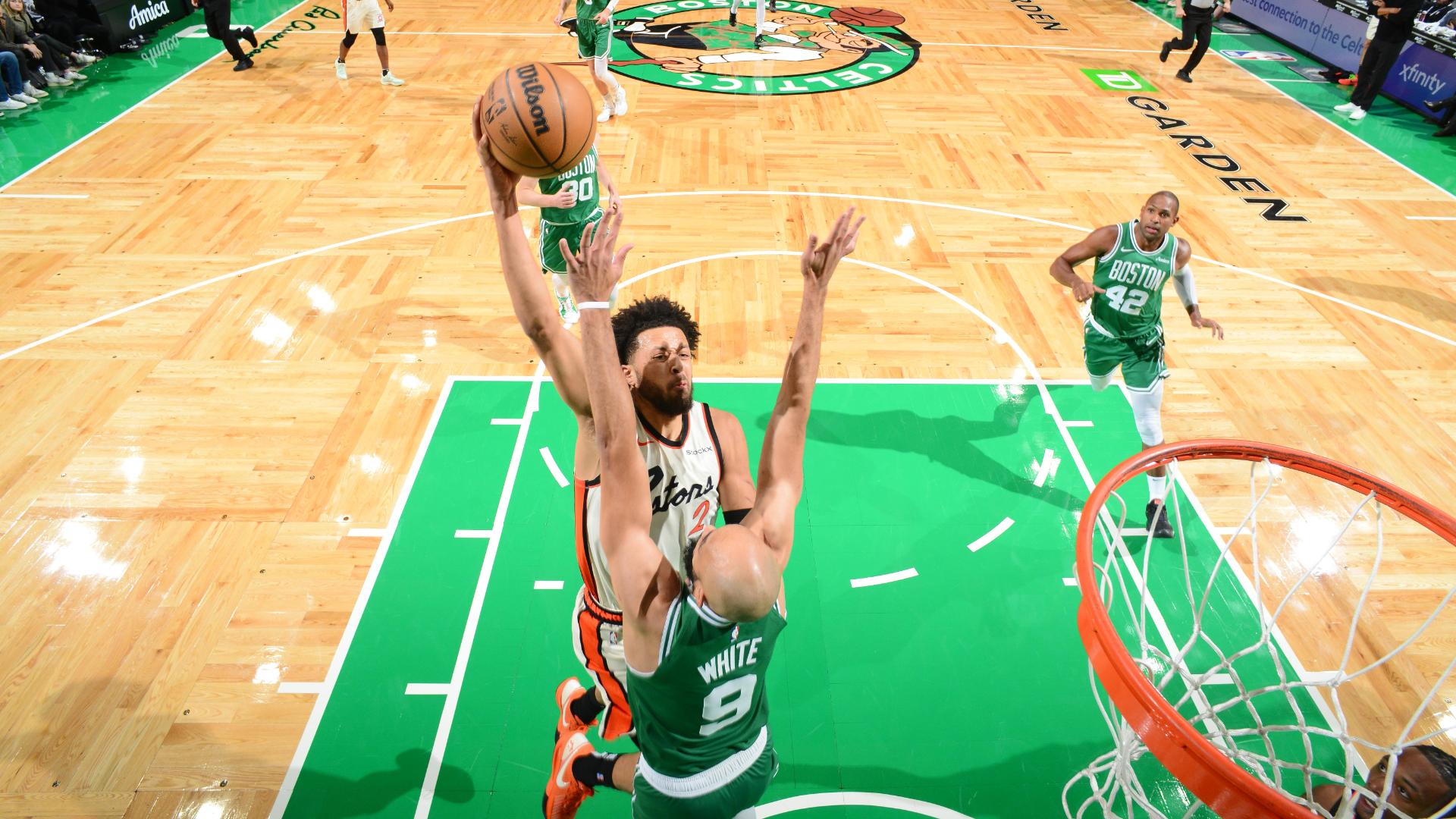 Cade Cunningham throws down a one-handed jam all over Derrick White early.
