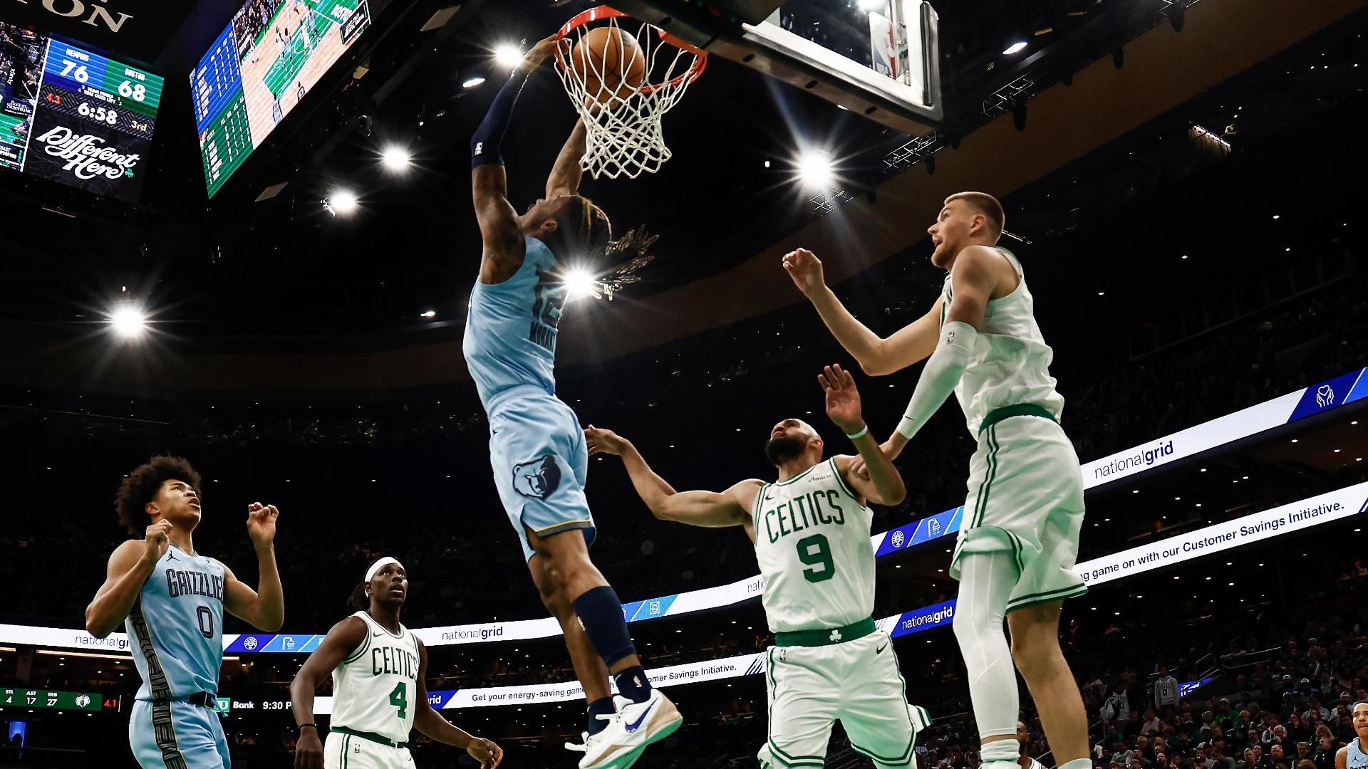 Ja Morant throws Kristaps Porzingis and Derrick White on a poster with a reverse dunk you have to see to believe.