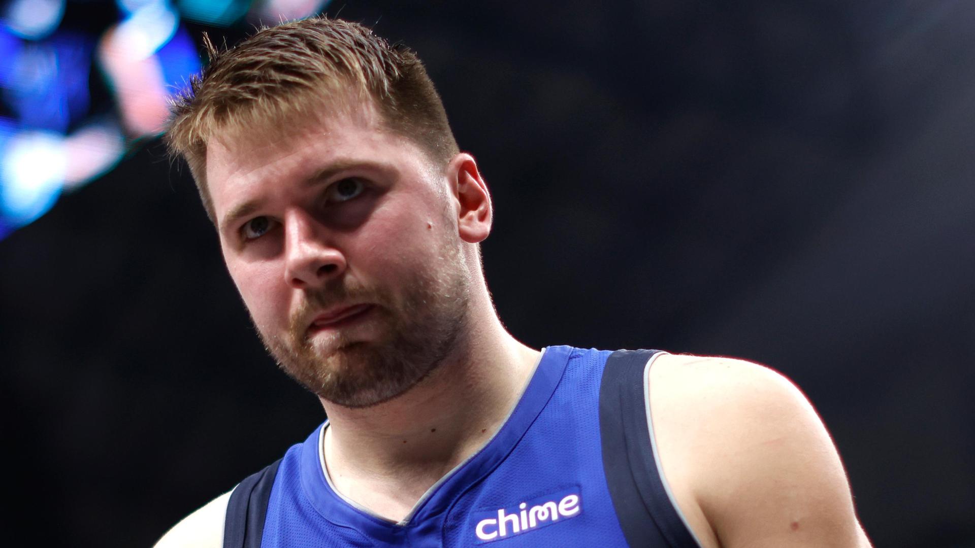 Luka Doncic feels some discomfort in his leg and limps to the locker room late in the second quarter.