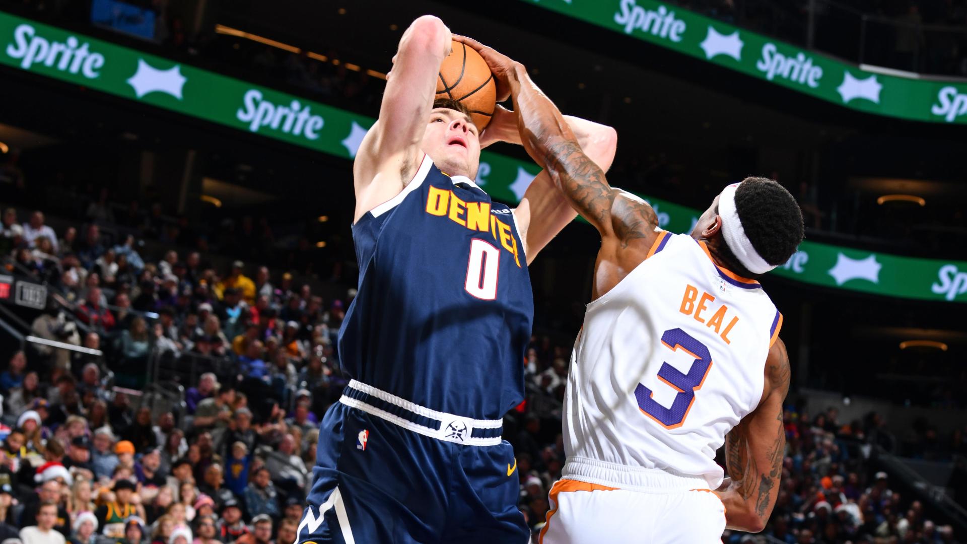 Bradley Beal stuffs Christian Braun at the rim, setting up Ryan Dunn for an alley-oop slam in transition.