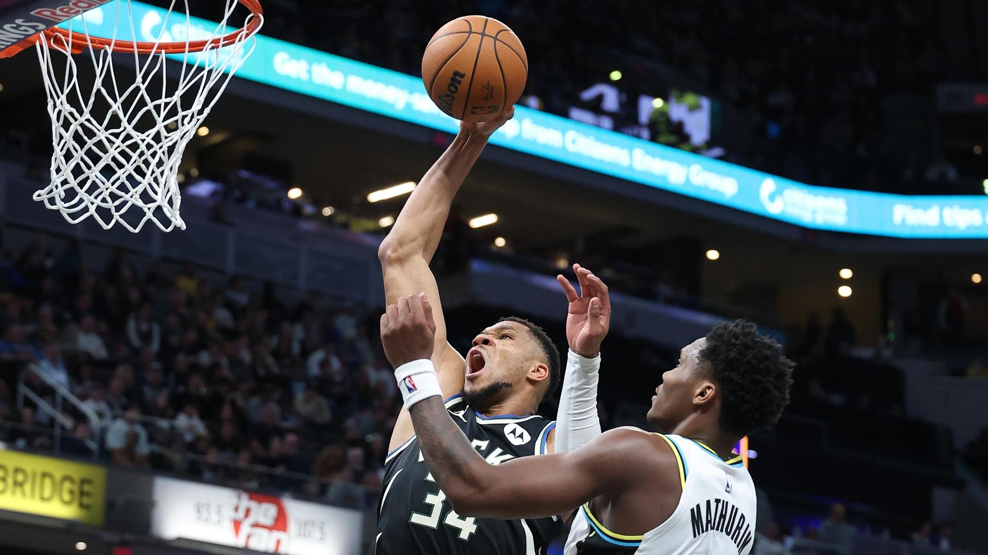 Giannis Antetokounmpo finds a lane off the give-and-go and stuffs one home.