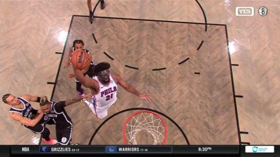 Joel Embiid throws down a powerful slam dunk vs. the Brooklyn Nets.
