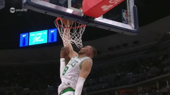 Kristaps Porzingis rises up for a putback slam.