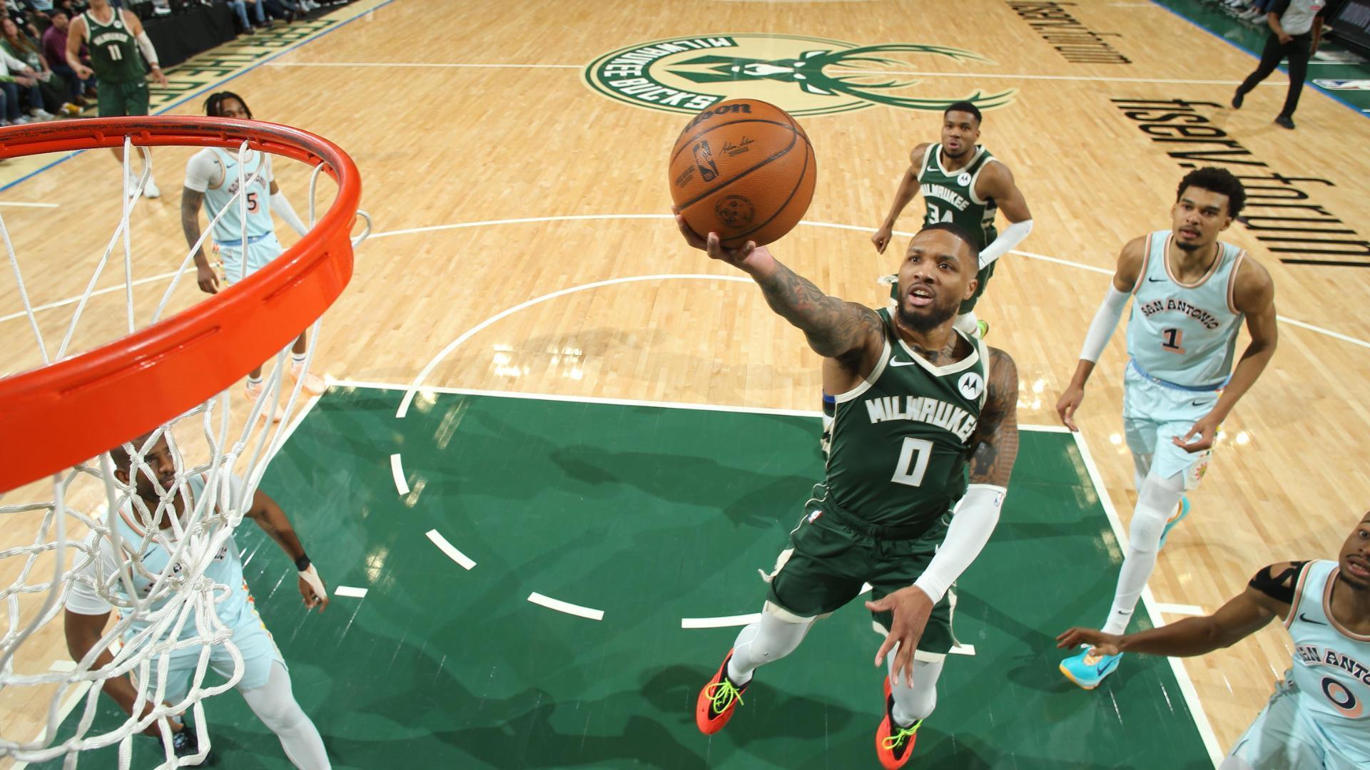 Damian Lillard uses his handle to blow by Keldon Johnson for a Bucks basket.