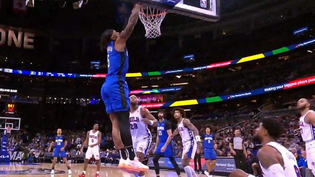 Paolo Banchero bodies Paul George and slams it home.
