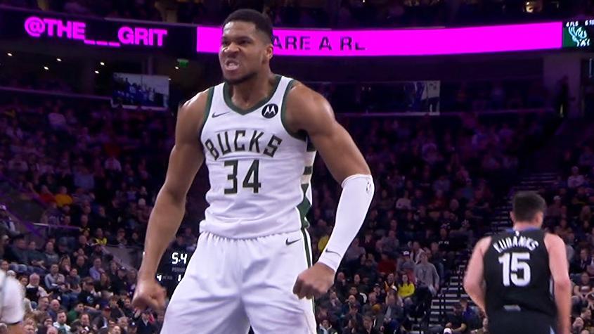 Giannis Antetokounmpo throws down a huge left-handed jam for the Bucks over a Jazz defender.