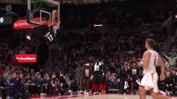 Shaedon Sharpe throws down a thunderous windmill dunk against the Suns.
