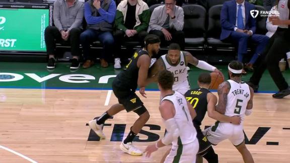 Damian Lillard drains a 3-pointer for the Bucks.