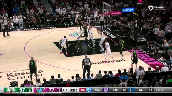 Jayson Tatum drives to the rim and powers through to extend the Celtics' late lead over the Heat.