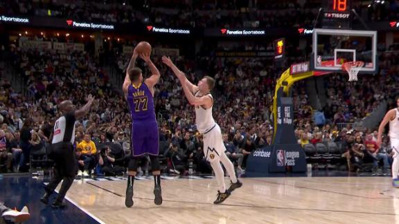 Luka Doncic hits a side-step 3 to force a timeout for the Nuggets.
