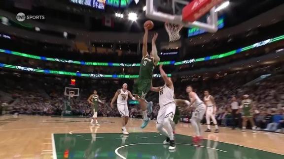 Brook Lopez drives for the jam and gets fouled for Milwaukee against Denver.