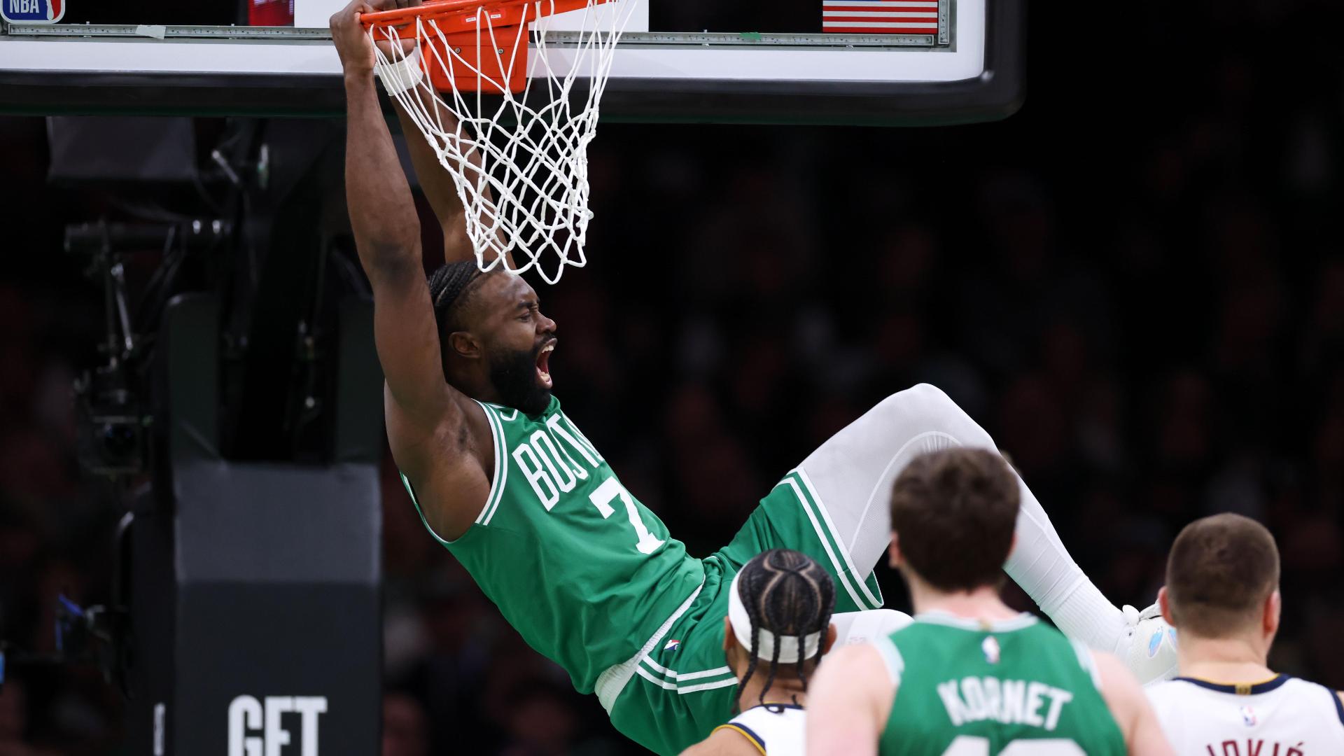 Jaylen Brown gets by his defender and crams home the dunk plus the foul.