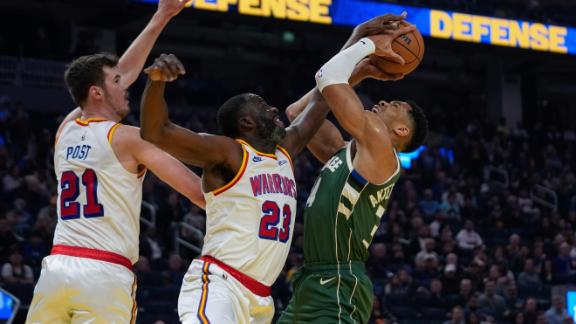 Draymond Green chases Giannis Antetokounmpo around the screen for the big block.